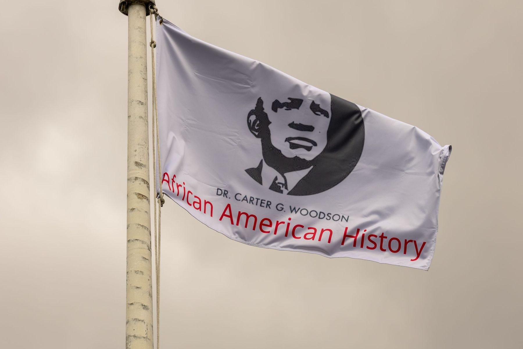 The Dr. Carter G. Woodson African American History flag over Lafayette
